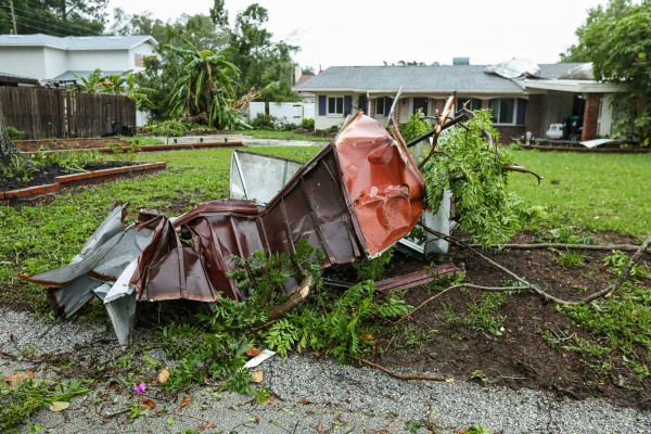 Storm debris in residential front yard 
